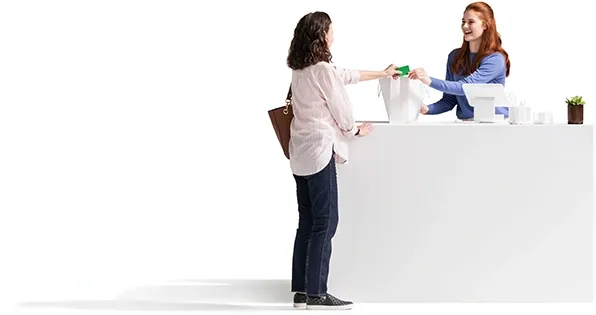 A woman accepts a credit card for a purchase.